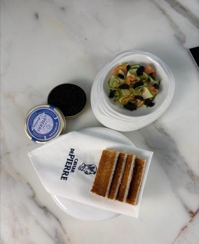 Smoked salmon pâté with cucumber ribbons and black caviar, with toast and caviar tins